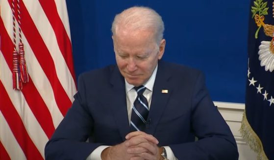 President Joe Biden smirks while ignoring reporters' questions after a media event on COVID-19 on Thursday.
