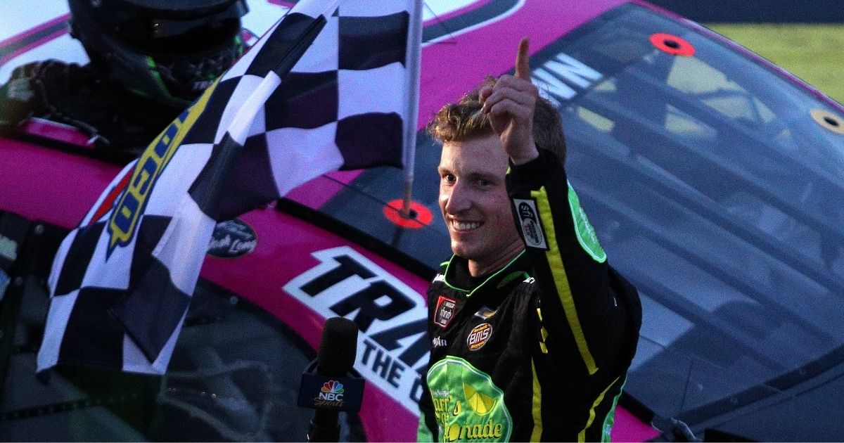 Brandon Brown, driver of the No. 68 Original Larry's Hard Lemonade Chevrolet, celebrates with the checkered flag after winning the NASCAR Xfinity Series Sparks 300 at Talladega Superspeedway in Alabama on Oct. 2.