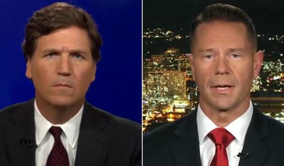 Lt. Col. Scott Duncan, right, talks with Fox News' Tucker Carlson about his effort to get a religious exemption to the military vaccine mandate.