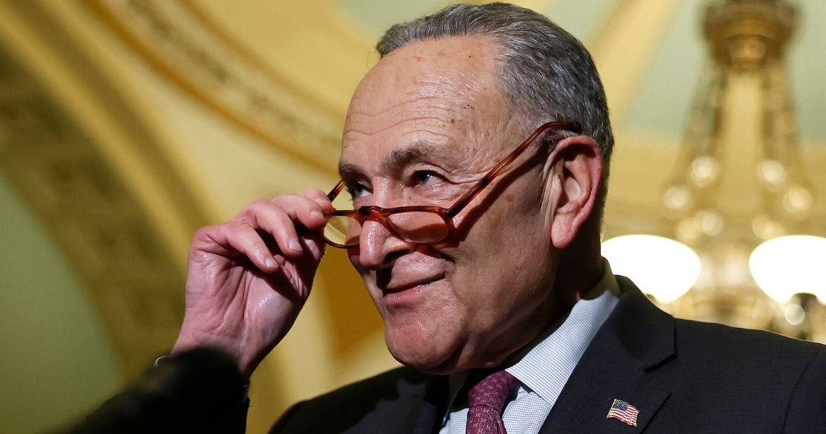 Senate Majority Leader Charles Schumer talks to reporters following the weekly Senate Democratic policy luncheon at the U.S. Capitol in Washington on Dec. 14.