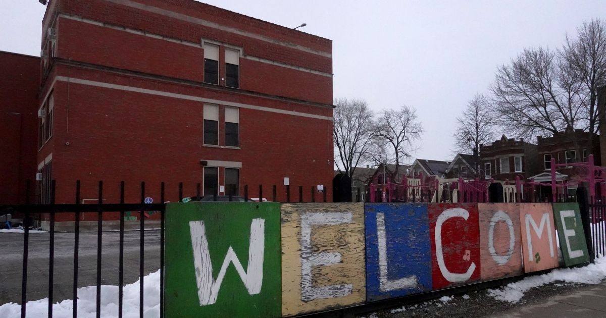 A sign on the fence outside of Chicago's Lowell Elementary School welcomed students back from their winter break on January 5, but the welcome was short-lived. Classes at all of Chicago public schools were canceled Wednesday after the teacher's union voted to return to virtual learning, in opposition to the Chicago Public Schools' plan to only close individual schools if COVID rates warranted the move.