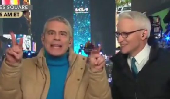 An admittedly 'overserved' Andy Coehn, left, went on a tipsy rant against outgoing New York Mayor Bill de Blasio as co-host Anderson Cooper begged him not to 'go on a rant' during CNN 's New Year's Eve program.