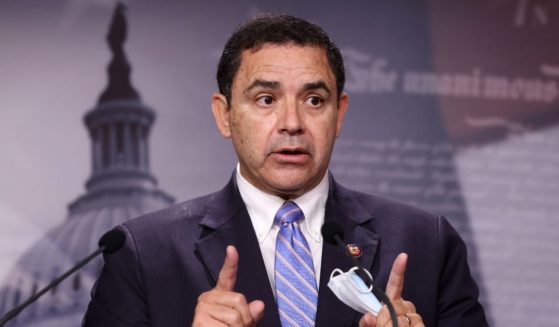 Rep. Henry Cuellar of Texas, seen in a file photo from July 2021, has pledged his cooperation after an FBI raid on his home and campaign office Wednesday. The FBI would not state the purpose of the raid. Some have observed the 'questionable' timing of the investigation, which comes during the moderate Democrat's re-election campaign.