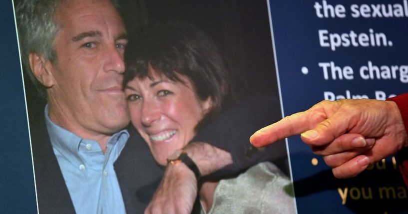 Federal prosecutors display a photo of Ghislaine Maxwell with her former boyfriend, Jeffrey Epstein, when announcing charges against the socialite during a July 2, 2020, news conference in New York City.