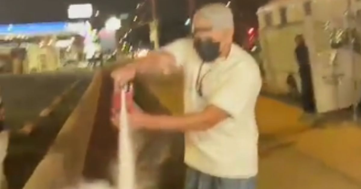 A viral video shows a man using a fire extinguisher to put out the cooking fire of a taco truck on Thursday night in Whittier, California.