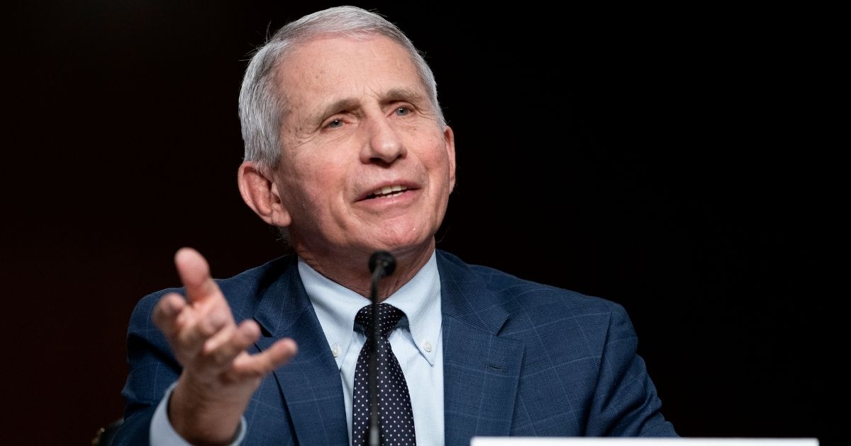 Dr. Anthony Fauci testifies before a Senate committee hearing Tuesday on Capitol Hill in Washington. Fauci was caught on a hot mic disparaging a senator and taking the Lord's name in vain.