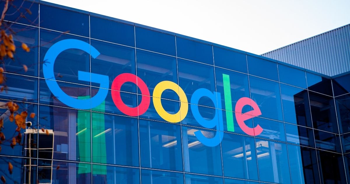 The Google logo is seen on the side of a building in this stock image