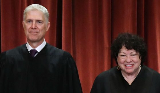 Supreme Court Justices Neil Gorsuch and Sonia Sotomayor pose for the court's official portrait in the East Conference Room of the Supreme Court building in Washington on Nov. 30, 2018.