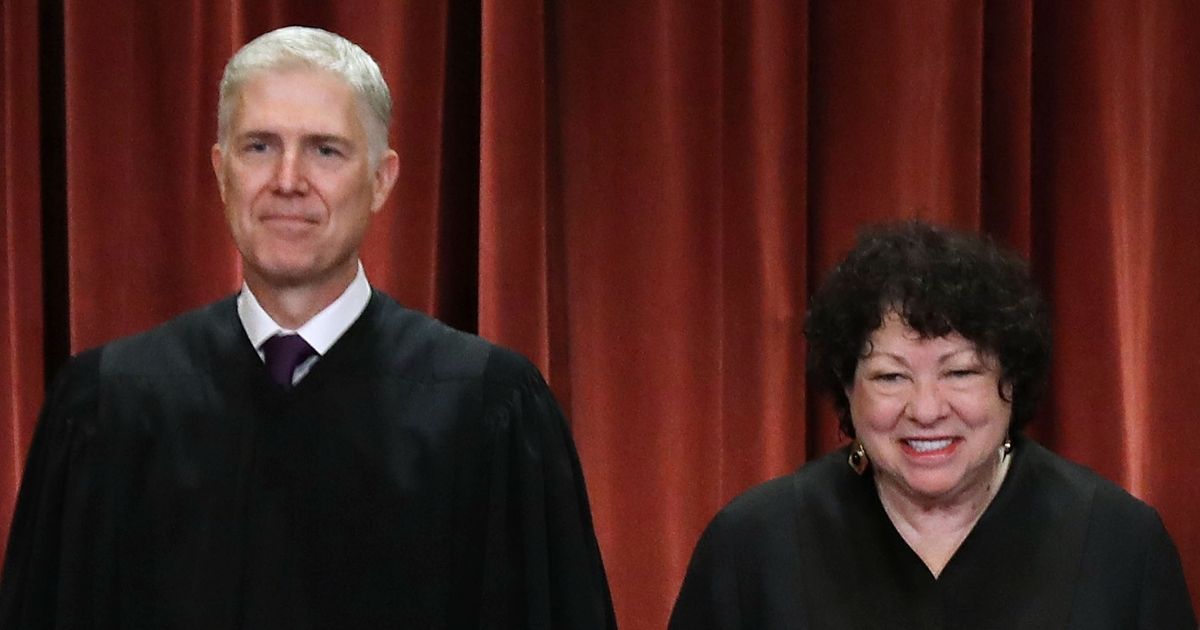 Supreme Court Justices Neil Gorsuch and Sonia Sotomayor pose for the court's official portrait in the East Conference Room of the Supreme Court building in Washington on Nov. 30, 2018.