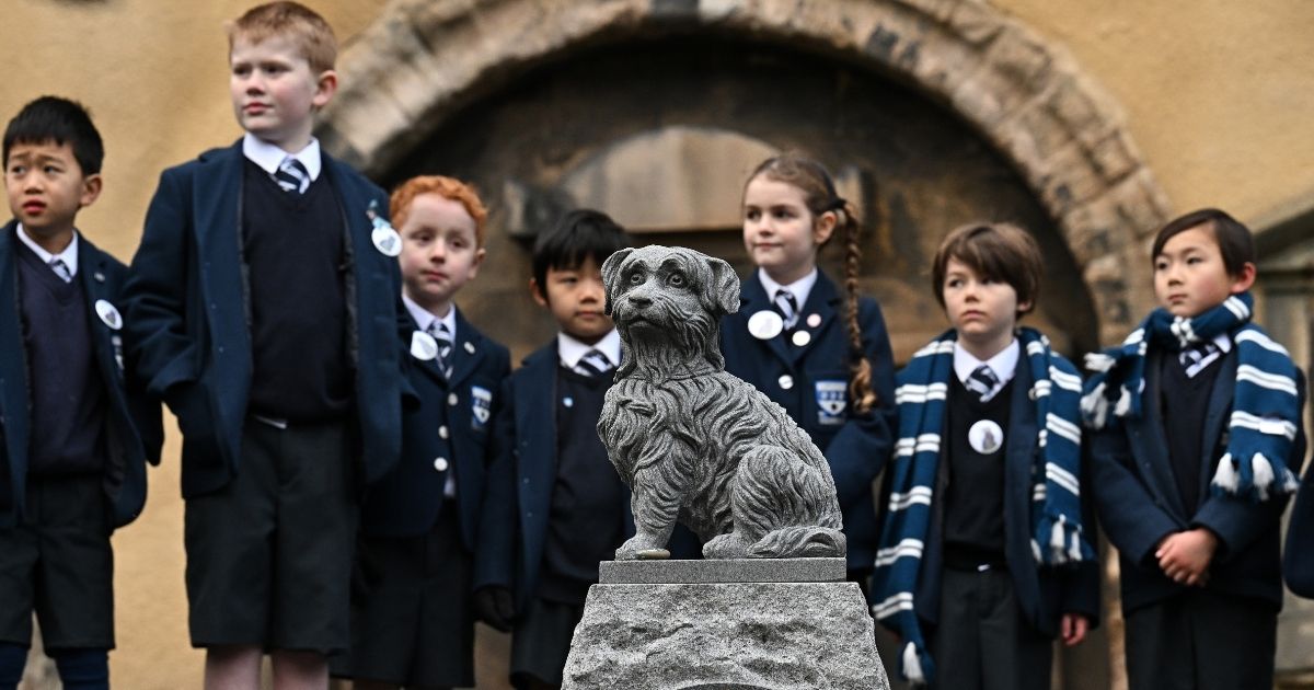 Pupils from George Heriot’s School in Edinburgh, Scotland, attend a memorial service commemorating the 150th anniversary since the death of Greyfriars Bobby, a Skye Terrier who became known for spending 14 years guarding the grave of his owner. Disney made a movie about the loyal little dog in 1961.