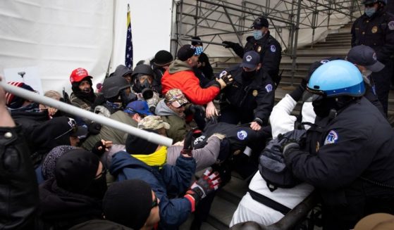 Protesters clash with police and security forces as people try to storm the US Capitol in Washington D.C on January 6, 2021. An analysis of the so-called 'insurrectionists' revealed they were much more 'mainstream' than the left previously realized.