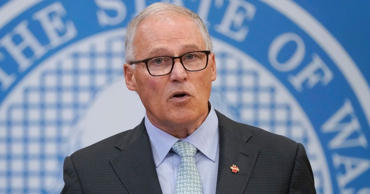 Washington's Democratic Gov. Jay Inslee gives a speech from the state Capitol in Olympia on Aug. 18, 2021, announcing an expansion of the state's vaccine mandate.