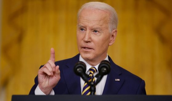 President Joe Biden talks to reporters during a news conference in the East Room of the White House in Washington on Wednesday.