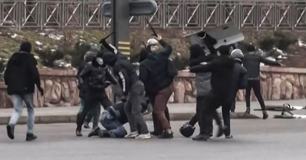 A frame grab taken on Thursday from an AFPTV video made on Wednesday shows protesters clashing with Kazakhstan's security forces during a demonstration in the country largest city Almaty as unprecedented unrest in the Central Asian nation spins out of control due to a hike in energy prices.