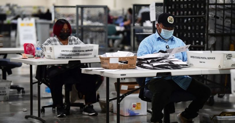 Mail-in ballots for the California recall election are processed at the Los Angeles County Registrar building at the Fairplex in Pomona, California, on Sept. 9, 2021.