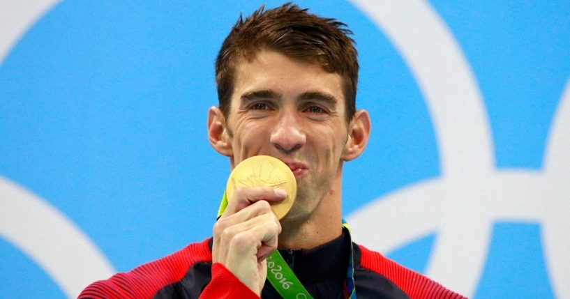 U.S. swimmer Michael Phelps celebrates his Olympic gold medal on the podium during the medal ceremony for the men's 200m Individual medley at the Olympic Aquatics Stadium in Rio de Janeiro on Aug. 11, 2016.