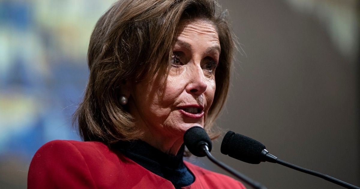 House Speaker Nancy Pelosi talks at the start of a discussion with historians Doris Kearns Goodwin and Jon Meacham about the Jan. 6 Capitol incursion on Thursday in Washington.