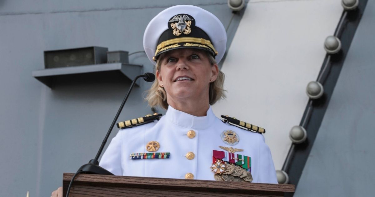 Capt. Amy Bauernschmidt, appointed commanding officer of the aircraft carrier USS Abraham Lincoln, delivers remarks during a change of command ceremony held on the flight deck on Aug. 19.