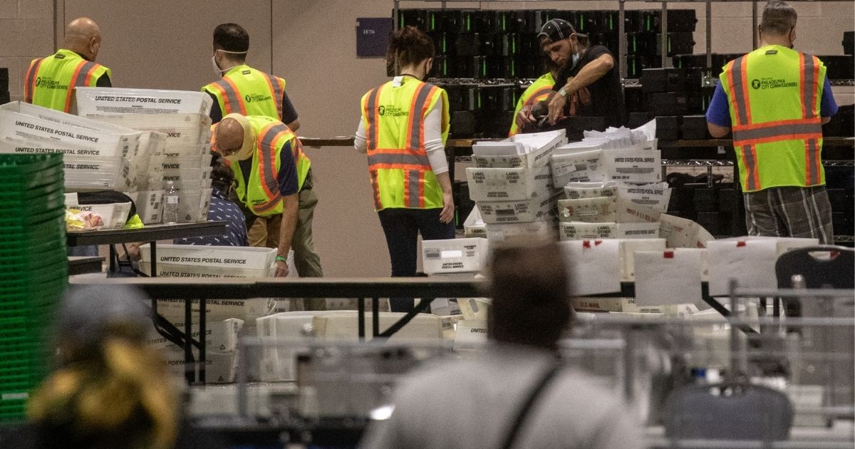 Election workers count ballots at the Philadelphia Convention Center on November 6, 2020. A Pennsylvania court Friday struck down a 2019 law that established no-excuse mail-in voting in the state.