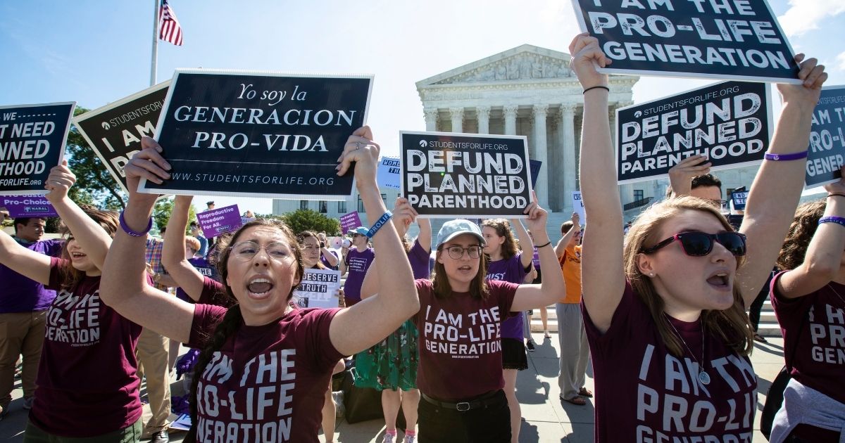 A group of pro-life college students demonstrate outside of the U.S. Supreme Court in Washington, D.C., on June 25, 2018.
