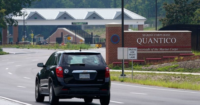 Traffic drives past the entrance sign of Marine Corps Base Quantico on Aug. 26, 2021, in Quantico, Virginia.
