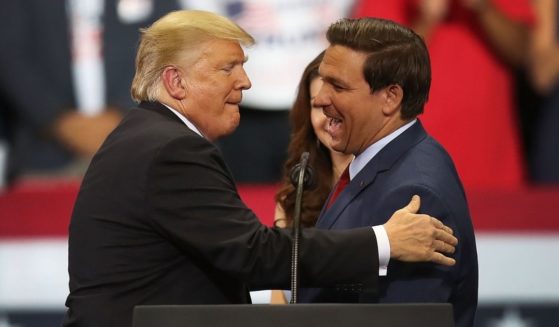 President Donald Trump greets Ron DeSantis during a campaign rally at Hertz Arena on Oct. 31, 2018, in Estero, Florida.