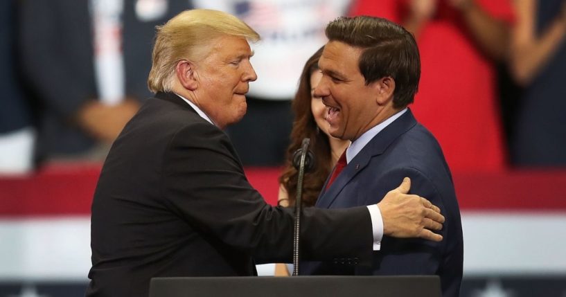 President Donald Trump greets Ron DeSantis during a campaign rally at Hertz Arena on Oct. 31, 2018, in Estero, Florida.