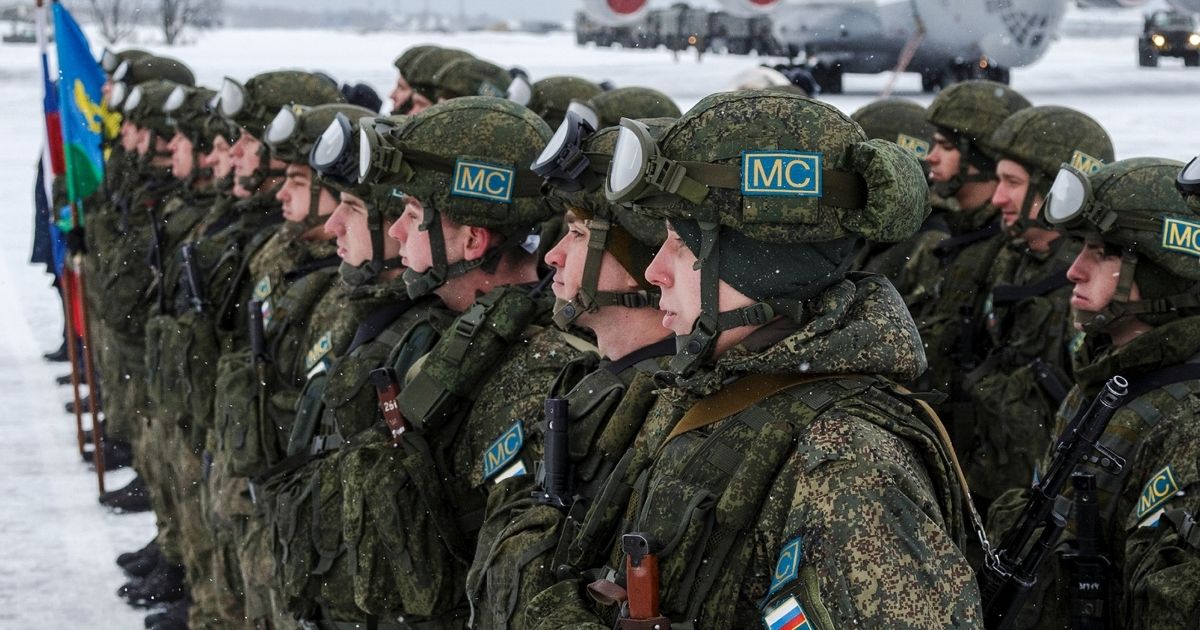 Russian troops, consisting of Russian peacekeepers of the Collective Security Treaty Organization, disembark a military plane outside of Moscow on Saturday after withdrawing from Kazakhstan.