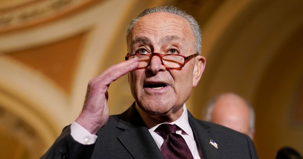 Democratic Senate Majority Leader Chuck Schumer of New York speaks to the media on Capitol Hill after a weekly Democratic policy luncheon on Dec. 7, 2021.