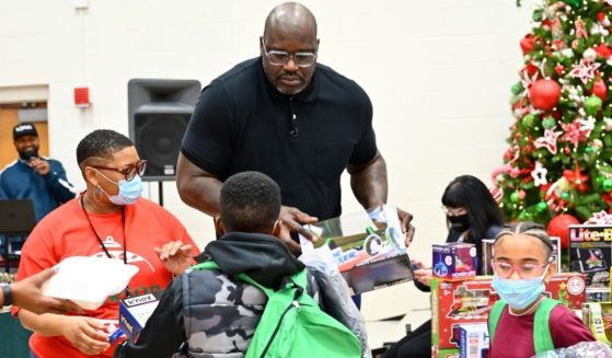 NBA legend Shaquille O'Neal surprises schoolchildren with toys and treats at a "Shaq-A-Claus" event in McDonough, Georgia, on Dec. 20.