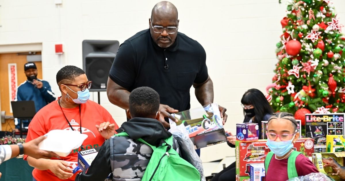 NBA legend Shaquille O'Neal surprises schoolchildren with toys and treats at a "Shaq-A-Claus" event in McDonough, Georgia, on Dec. 20.