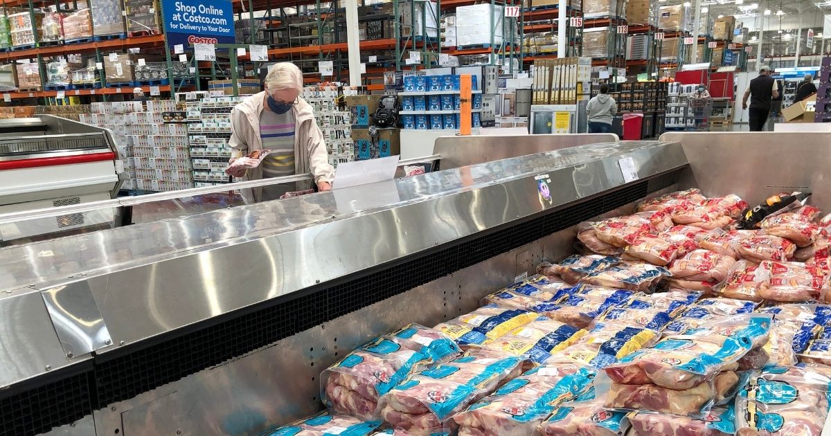 A woman shops for meat at a Costco store in Novato, California, on May 24.