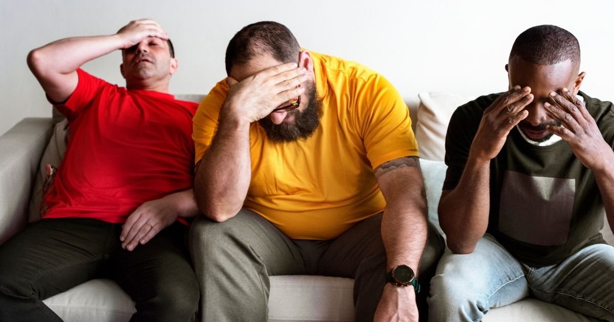 This stock image shows a group of upset sports fans. The NFL is reportedly considering an alternate site for Super Bowl LVI due to California's COVID-19 restrictions.