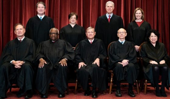 Members of the Supreme Court pose for a group photo at the Supreme Court in Washington on April 23. Seated from left: Associate Justice Samuel Alito, Associate Justice Clarence Thomas, Chief Justice John Roberts, Associate Justice Stephen Breyer and Associate Justice Sonia Sotomayor. Standing from left: Associate Justice Brett Kavanaugh, Associate Justice Elena Kagan, Associate Justice Neil Gorsuch and Associate Justice Amy Coney Barrett.