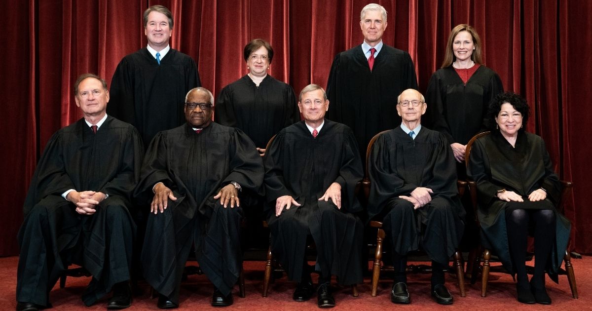 Members of the Supreme Court pose for a group photo at the Supreme Court in Washington on April 23. Seated from left: Associate Justice Samuel Alito, Associate Justice Clarence Thomas, Chief Justice John Roberts, Associate Justice Stephen Breyer and Associate Justice Sonia Sotomayor. Standing from left: Associate Justice Brett Kavanaugh, Associate Justice Elena Kagan, Associate Justice Neil Gorsuch and Associate Justice Amy Coney Barrett.
