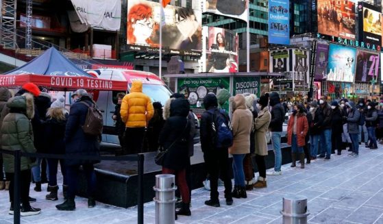 People line up for COVID-19 testing amid the spread of the omicron variant in New York's Times Square on Jan. 4.