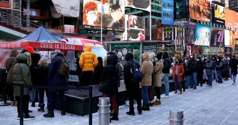 People line up for COVID-19 testing amid the spread of the omicron variant in New York's Times Square on Jan. 4.