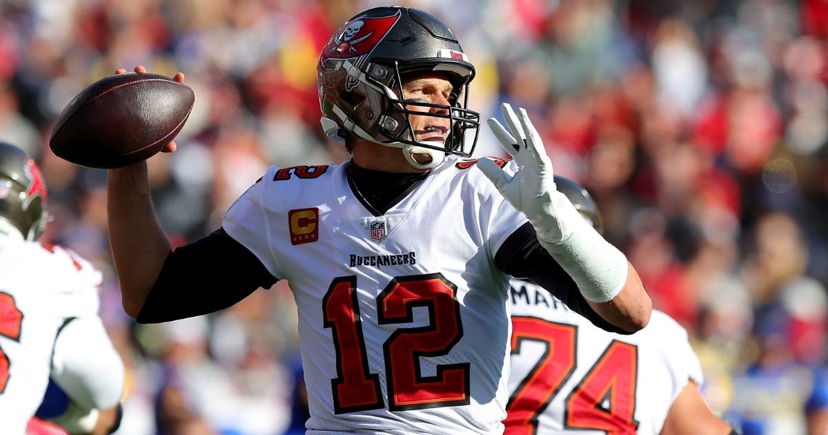 Tom Brady of the Tampa Bay Buccaneers, seen throwing a pass in Sunday's game against the Los Angeles Rams, may soon announce his retirement, according to an unnamed source close to the football star.