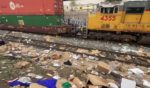 A Union Pacific train passes by an area littered with stolen packages. Rail thefts have increased 160 percent in Los Angeles County over the past year, and railroad officials believe the increase is due to the LA County District Attorney’s policy of not prosecuting low-level crimes