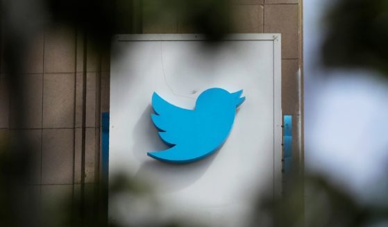 The Twitter logo is shown on a door outside the Twitter offices in San Francisco, California, on July 9, 2019.