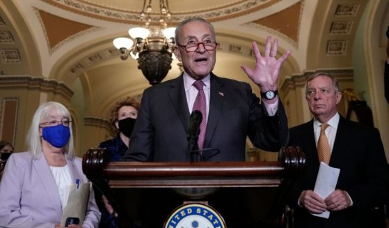 Senate Majority Leader Chuck Schumer speaks to reporters with Democratic Sens. Patty Murray, left, and Sen. Dick Durbin, right, at a September news conference in the Capitol.