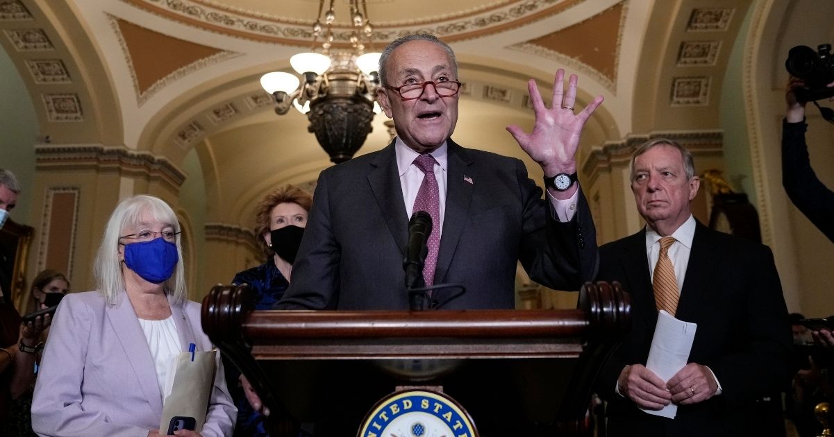 Senate Majority Leader Chuck Schumer speaks to reporters with Democratic Sens. Patty Murray, left, and Sen. Dick Durbin, right, at a September news conference in the Capitol.