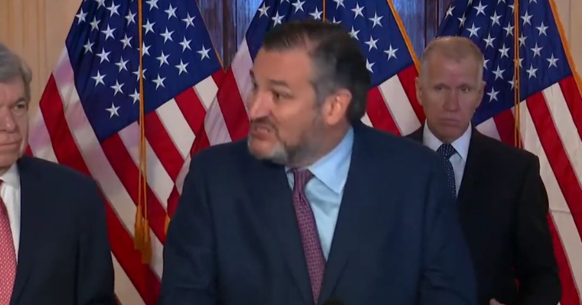 An angry Ted Cruz makes a point about what he called mask 'hypocrisy' by slamming his fists on the podium at a news conference on Jan. 11, 2021.