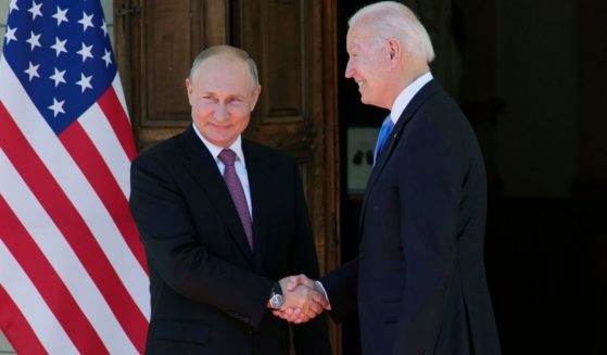 President Joe Biden and Russian leader Vladimir Putin shake hands during their summit meeting in Geneva, Switzerland, on June 16, 2021.