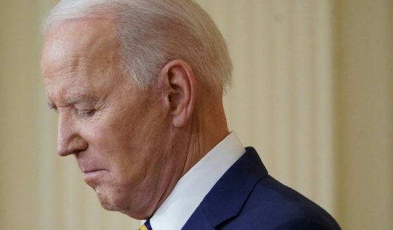 President Joe Biden pauses during a news conference in the East Room of the White House on Jan. 19, 2022.