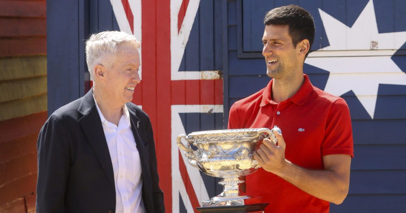 Serbia's Novak Djokovic, right, stands with Australian Open tournament director Craig Tiley following his win at the Australian Open in Melbourne, Australia, on Feb. 22, 2021.