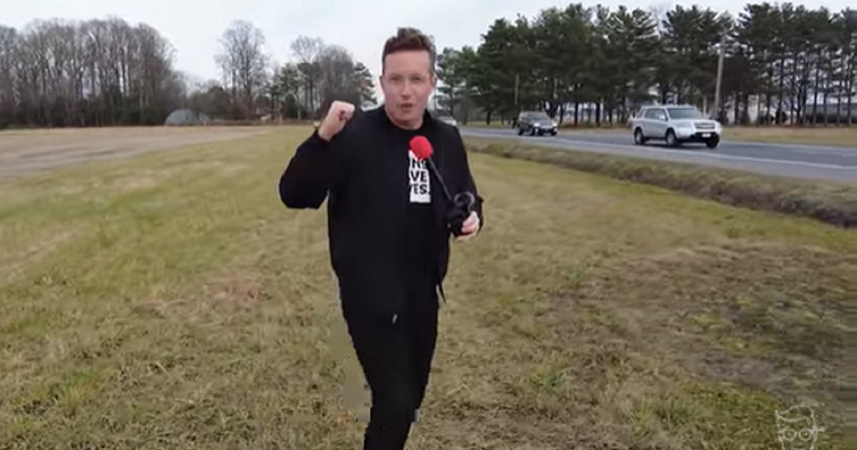 Benny Johnson, chief creative officer for the conservative group Turning Point USA, is pictured in a video he shot in Delaware, near a "Let's Go Braden" sign erected on the road that leads to President Joe Biden's Rehobeth Beach vacation home.