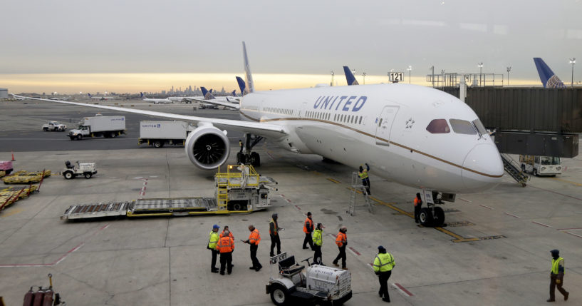A Dreamliner 787-10 pulls up to a gate at Newark Liberty International Airport in Newark, N.J., in this file photo from January 2019. Federal safety officials say interference from the impending 5G wireless networks may create interference that could delay systems like thrust reversers on Boeing 787s from kicking in, leaving only the brakes to slow the plane.