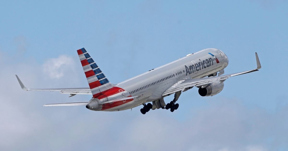 An American Airlines flight going between Los Angeles and Washington, D.C., was stopped in Kansas City after a passenger tried to storm the cockpit and attempted to open the plane door.