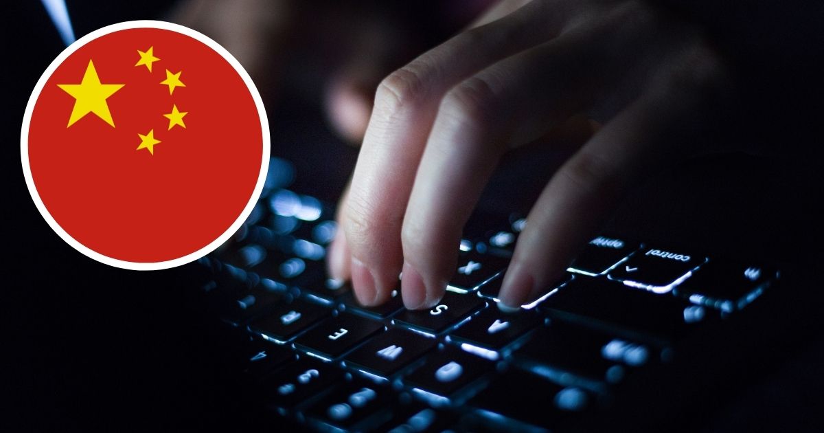 The Chinese flag is shown over a stock image of a woman typing on a laptop.